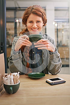 Woman, cup and happy in coffee shop for portrait at breakfast to start morning at table. Girl, person and smile in