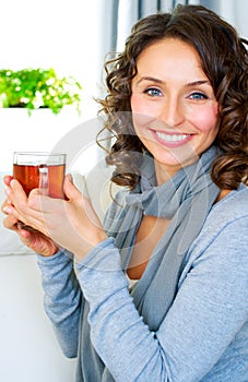 Woman with cup of hot tea