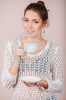 Woman with cup and saucer