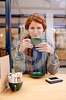 Woman, cup and smile in coffee shop for portrait at breakfast to start morning at table. Girl, person and happy in