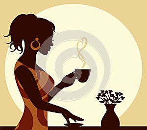 Woman with a cup of steaming coffee in hand