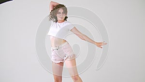 Woman with curls dancing
