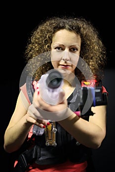 Woman with curly hair (mr) in a special vest with