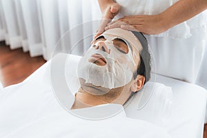 Woman customer indulges in rejuvenating with facial skincare mask. Quiescent