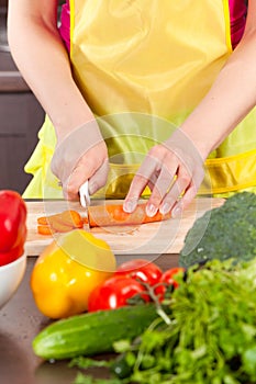 Woman cut carrot