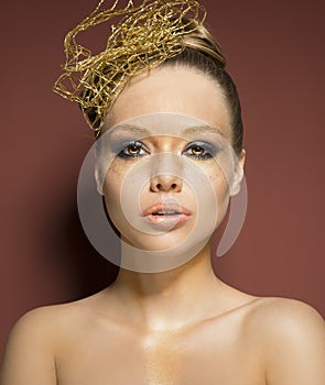 Woman with cute golden make-up