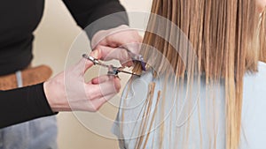 woman cuts little girl's wet hair. cutting hair at home.