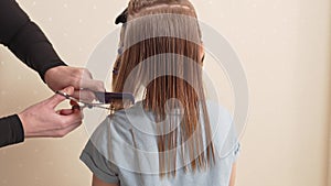 woman cuts little girl's wet hair. cutting hair at home.