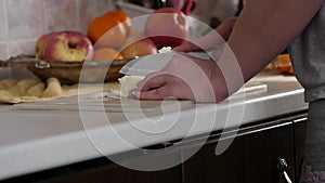 Woman cuts onions on a wooden board. slow motion
