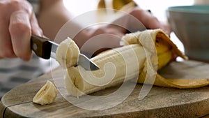 Woman cutting banana