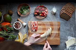 Woman cutting bananas