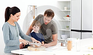 Woman cutting bread for her family