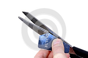 Woman cutting cut credit card