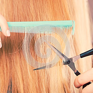 Woman cutting down smoothy hair.