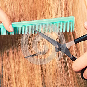 Woman cutting down smoothy hair.