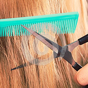 Woman cutting down smoothy hair.