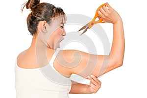 Woman cutting fat in arm