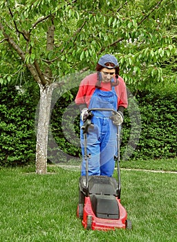 Woman cutting the grass