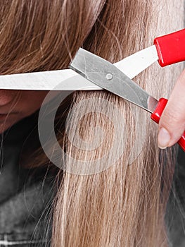 Woman cutting her fringe.