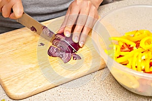 Woman cutting onion