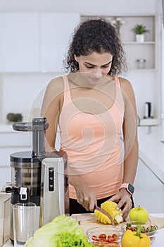 Woman cutting pineapple to make juice