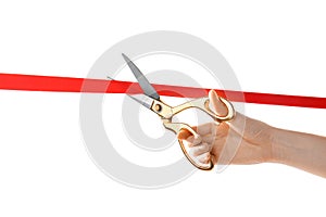 Woman cutting red ribbon