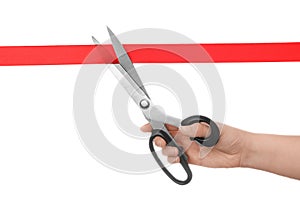 Woman cutting red ribbon with scissors. Traditional ceremony