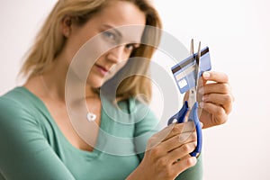 Woman Cutting Up Credit Card