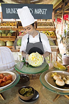 Woman cutting a Watermelon as hibiscus flower