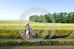 Woman cycling countryside