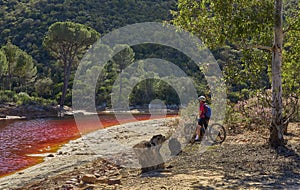 woman cycling at Rio Tinto, Andalusia, Spain