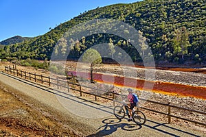 woman cycling at Rio Tinto, Andalusia, Spain