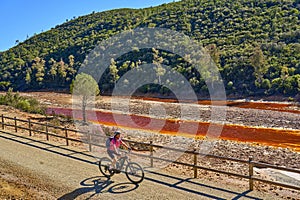 woman cycling at Rio Tinto, Andalusia, Spain