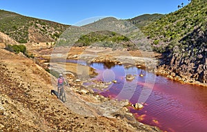 woman cycling at Rio Tinto, Andalusia, Spain