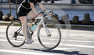 Woman cycling to lose weight and keep fit