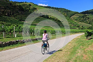 Woman cyclist touring Austria Wachau region
