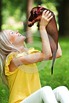 Woman dachshund in her arms