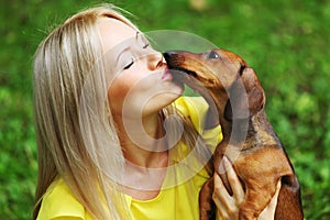 Woman dachshund in her arms