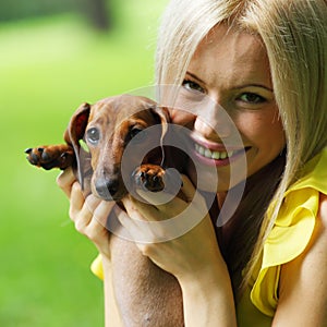 Woman dachshund in her arms