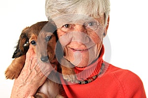 Woman and dachshund puppy