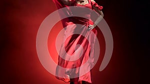 Woman dance of Argentine flamenco . Llight from behind. Smoke background. Slow motion