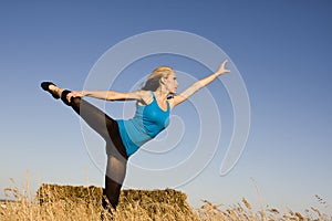 Woman in Dance Pose in a Field