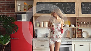 Woman Dances in Kitchen