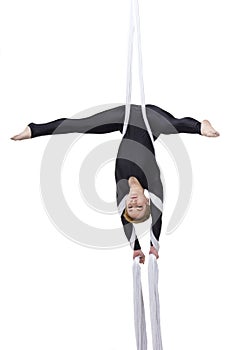 Woman dancing with aerial silks