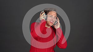 Woman dancing with Analog, corded headphones