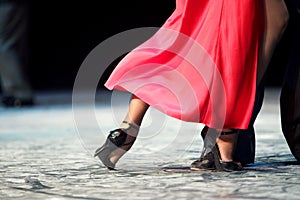 Woman dancing Argentinian tango in red dress