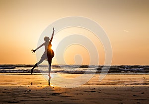 Woman dancing on the beach