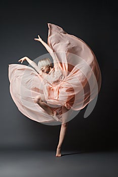 Woman dancing in chiffon dress