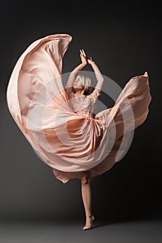 Woman dancing in chiffon dress