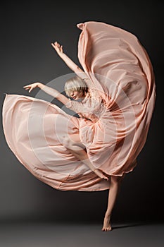 Woman dancing in chiffon dress